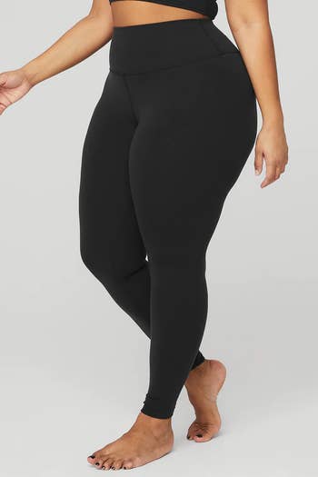 Model in a pair of black leggings 