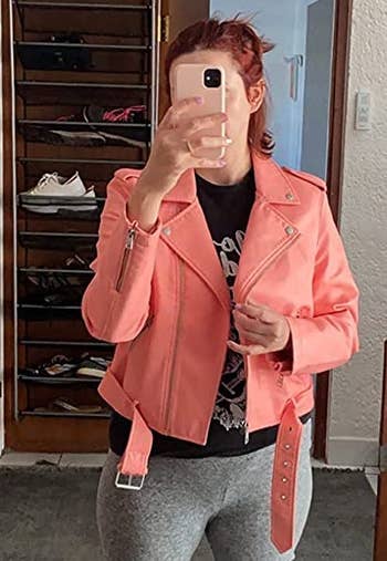 reviewer wearing the pink jacket