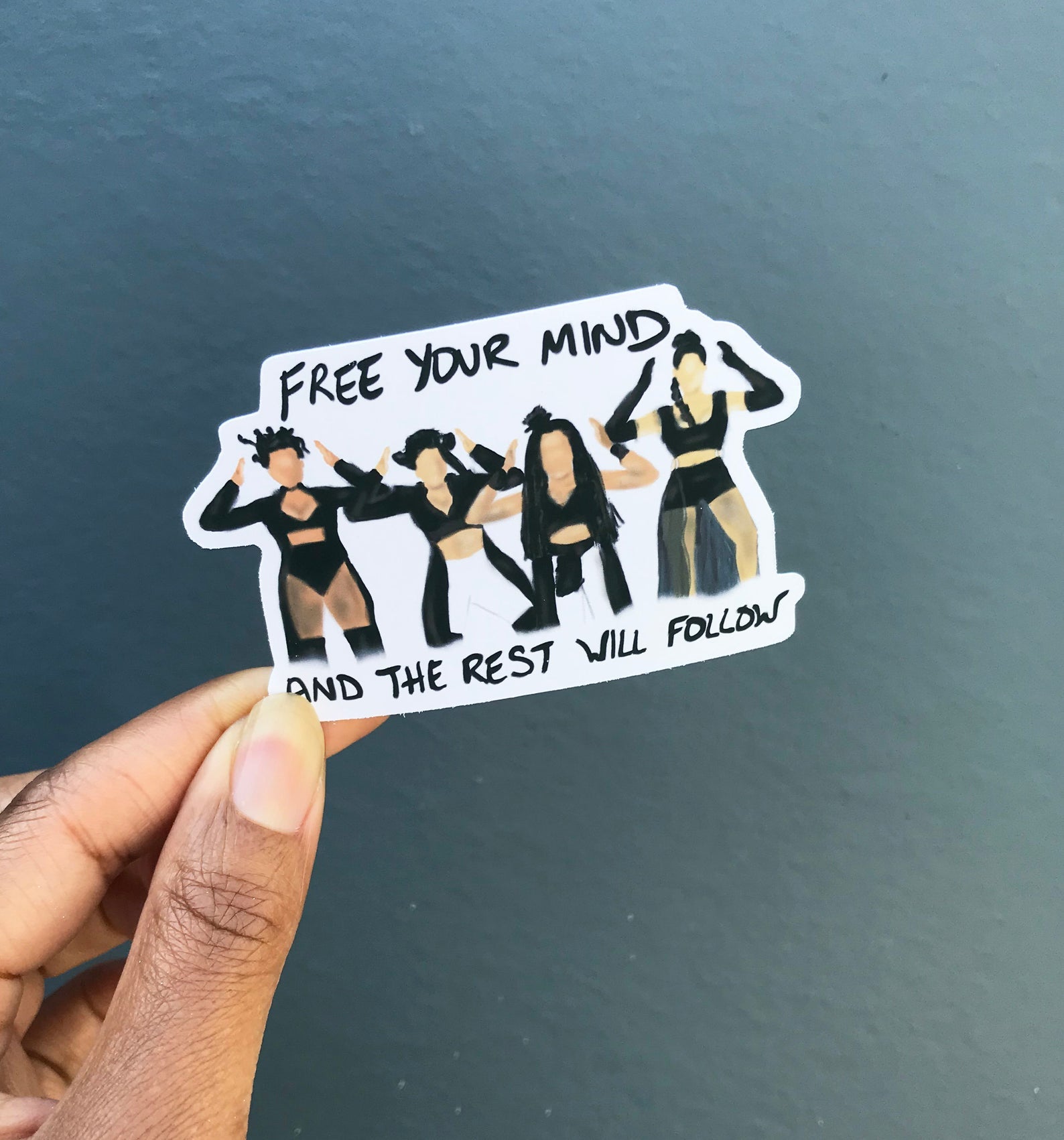 en vogue sticker featuring illustrations of the four group members and the words 