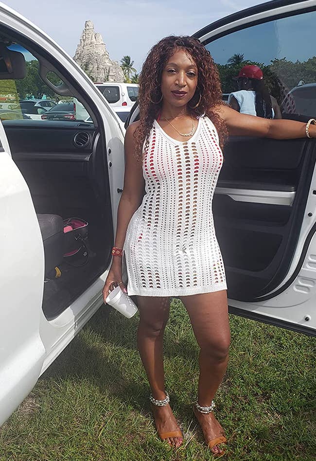 reviewer wearing the white crochet dress