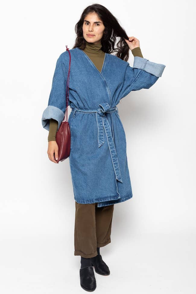 model wearing denim wrap coat