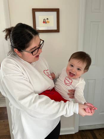 buzzfeed editor and her son in coordinating white sweatshirts with personalized hearts on each