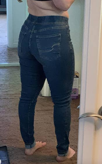 reviewer showing backside of the jeans 