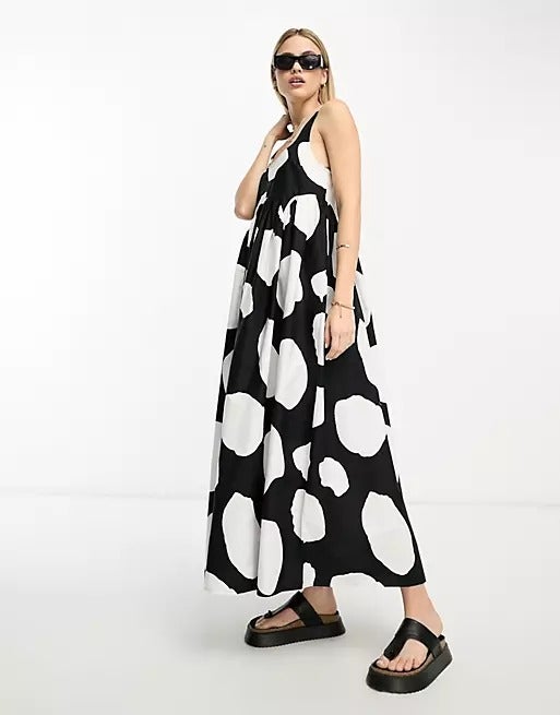 model wearing the black and white smock dress