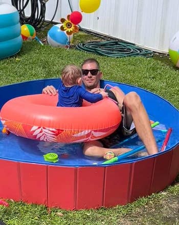 A reviewer and their child in the pool