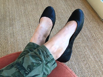 reviewer wearing the flats in black