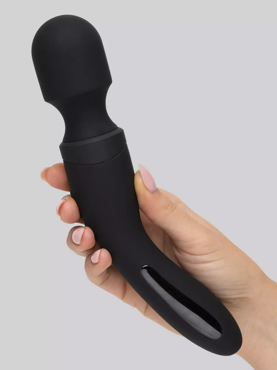 Model holding black wand vibrator