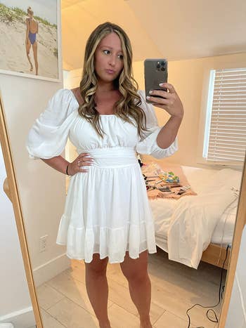 image of reviewer wearing the white dress in a large