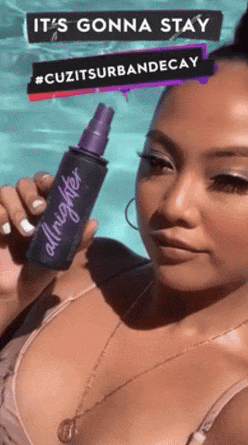 gif of model swimming after using setting spray, makeup is still perfect after