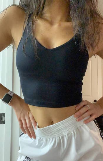 reviewer wearing the black workout top