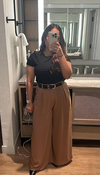 reviewer wearing the pants in brown