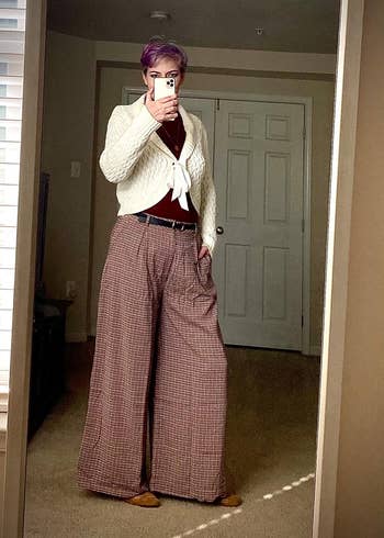 reviewer wearing the wide-leg pants in brown plaid