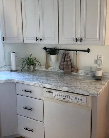 after of the countertop covered in faux marble contact paper