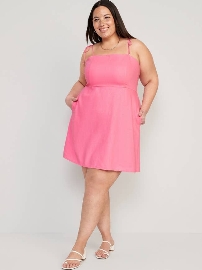a model in a pink cami dress