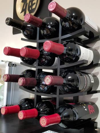 Reviewer image of the black rack with 12 bottles