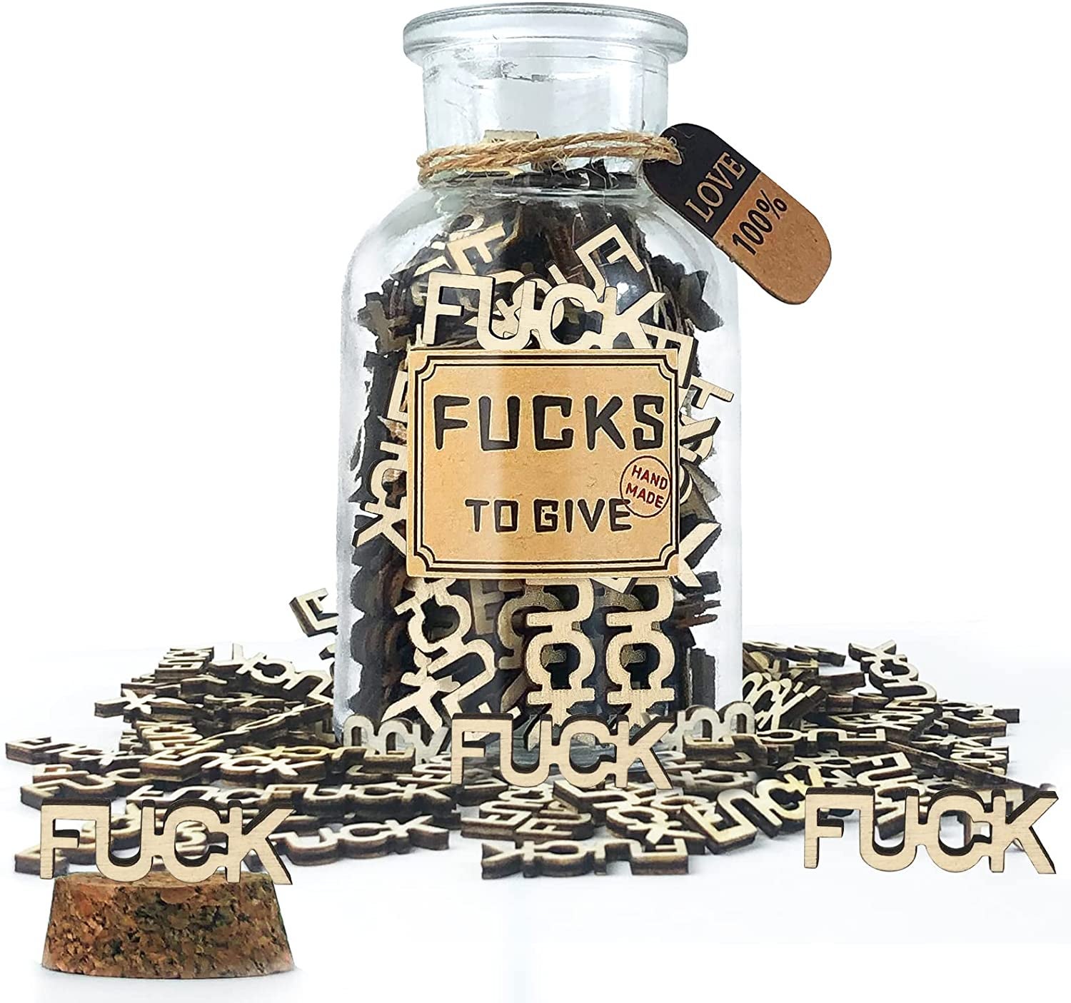 glass jar full of wood cut words. all say fuck.