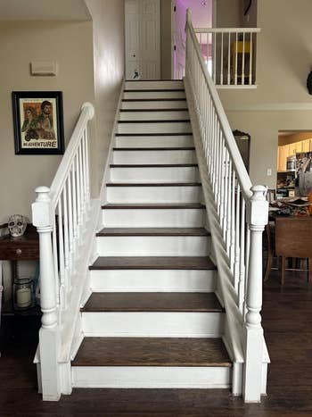 Interior staircase with white railings in a home
