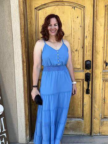 a reviewer wearing the same dress in blue 