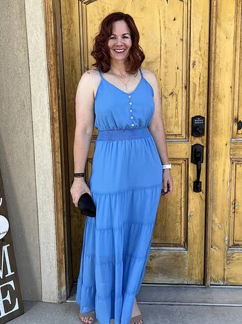 a reviewer wearing the same dress in blue 