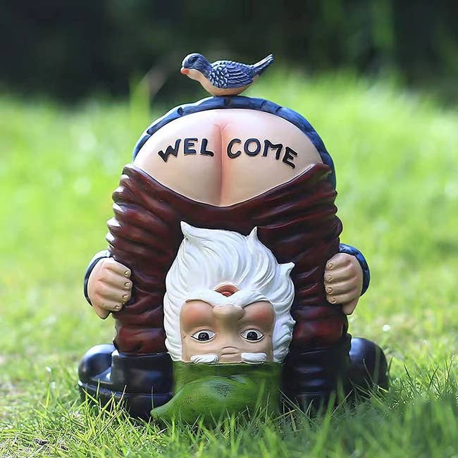 garden gnome bending over with pants pulled down. over the butt it says welcome.