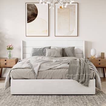 Modern chamber  with a plush bed, patterned throw, and abstract creation  above. Flanked by woody  nightstands with decor accents