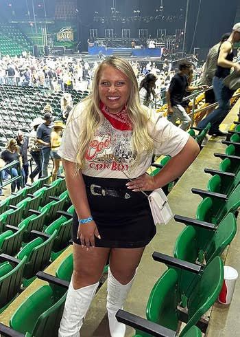 a reviewer in white boots at a concert