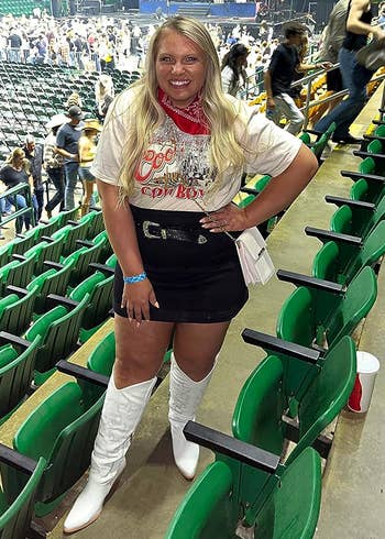 a reviewer in white boots at a concert