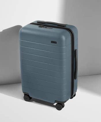 the outside of blue away carry on with hard shell 