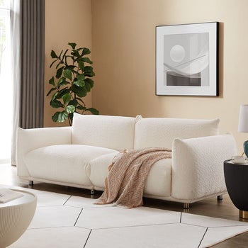 the side view of the white couch in a living room