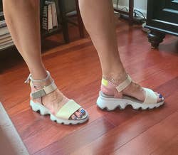 Reviewer pic of the sandals in white, pale yellow, and pale pink