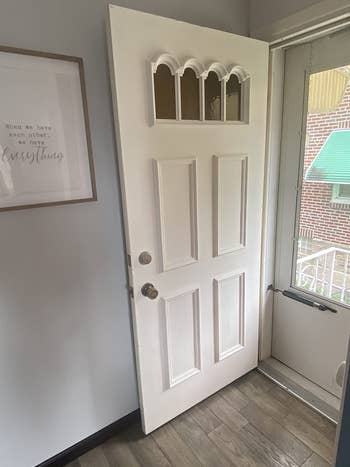 on left: white metal door without any paint in home