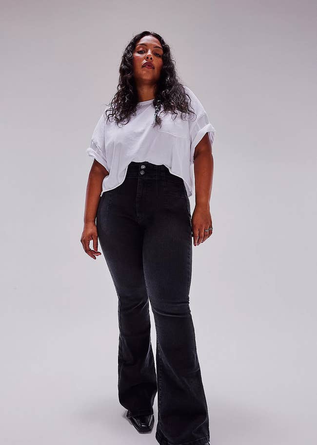 Woman in a basic white tee and classic black jeans for a versatile look