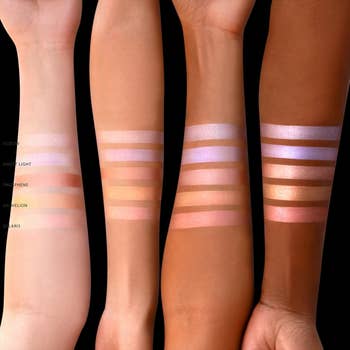 Models with four different skin tones showing five different shades of the luminizer on their arms