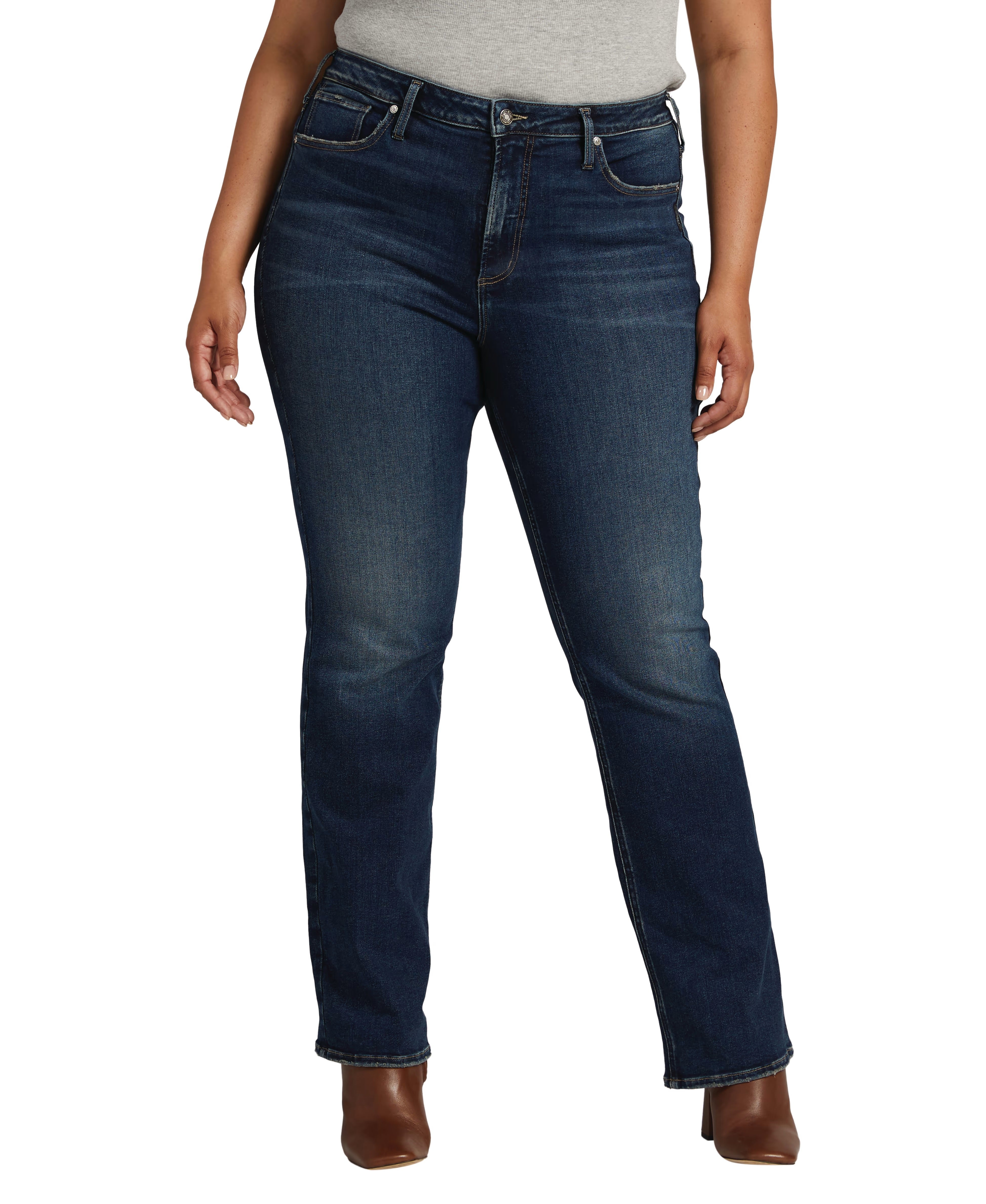 close up of the indigo high waisted boot cut jeans on a plus size model