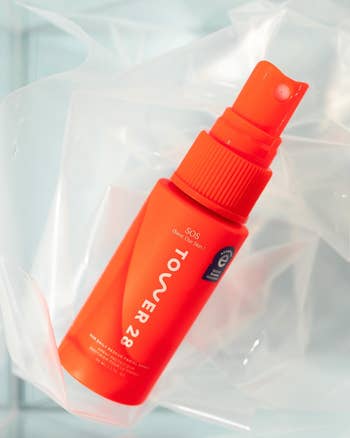 the small orange spray bottle