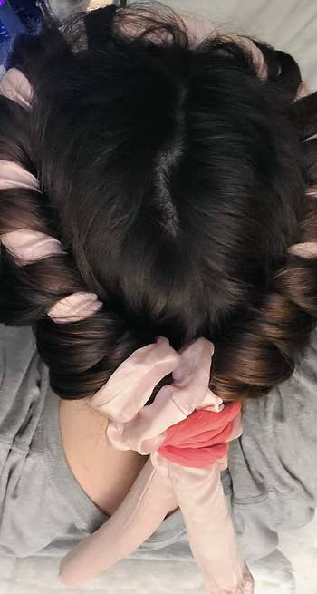 reviewer's hair with curling rod in it