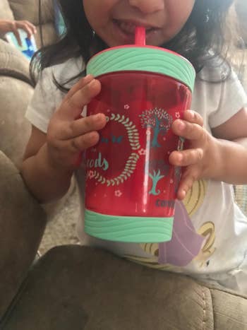 reviewer's child sipping from the cup
