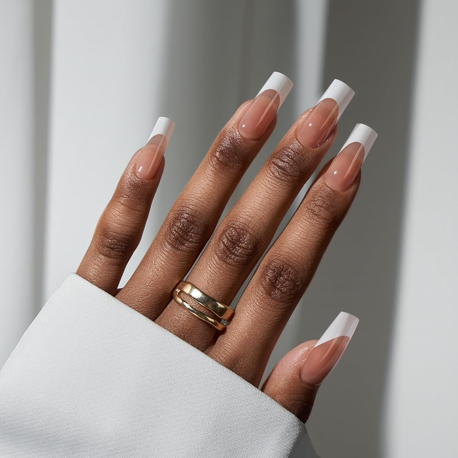 a hand with the long square tip press ons