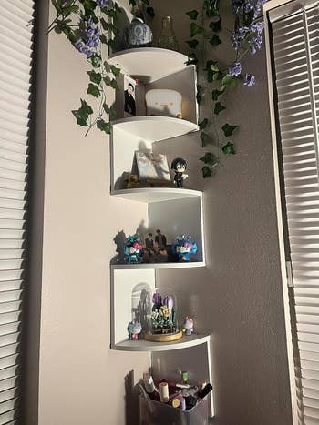 A reviewer photo of the white corner shelf