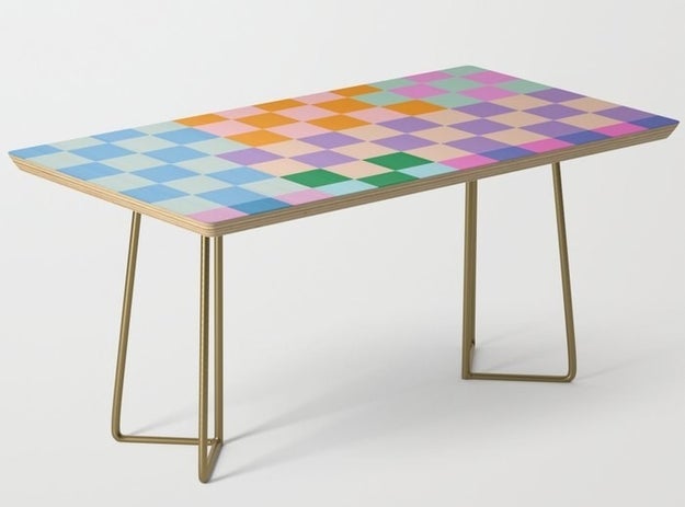 The checkerboard table with gold legs
