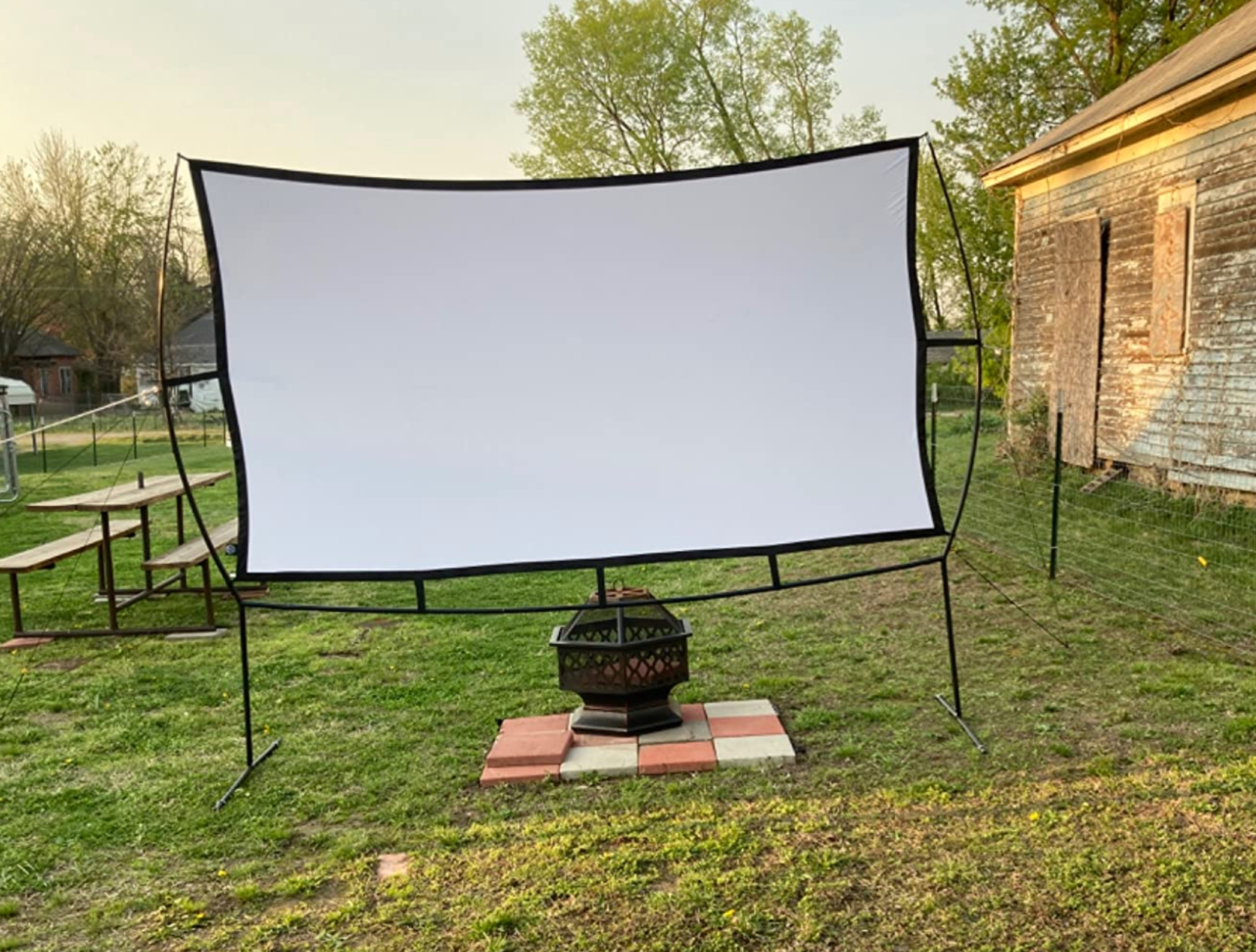 reviewers set-up with movie projector in yard