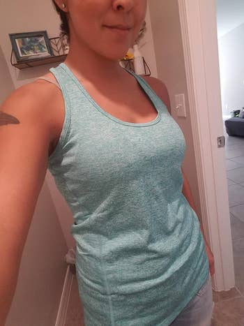 A reviewer wearing the tank in blue