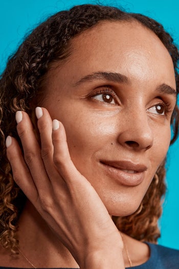 model with a dewy looking face