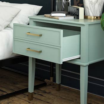 lifestyle image of bleached table nightstand with drawers open