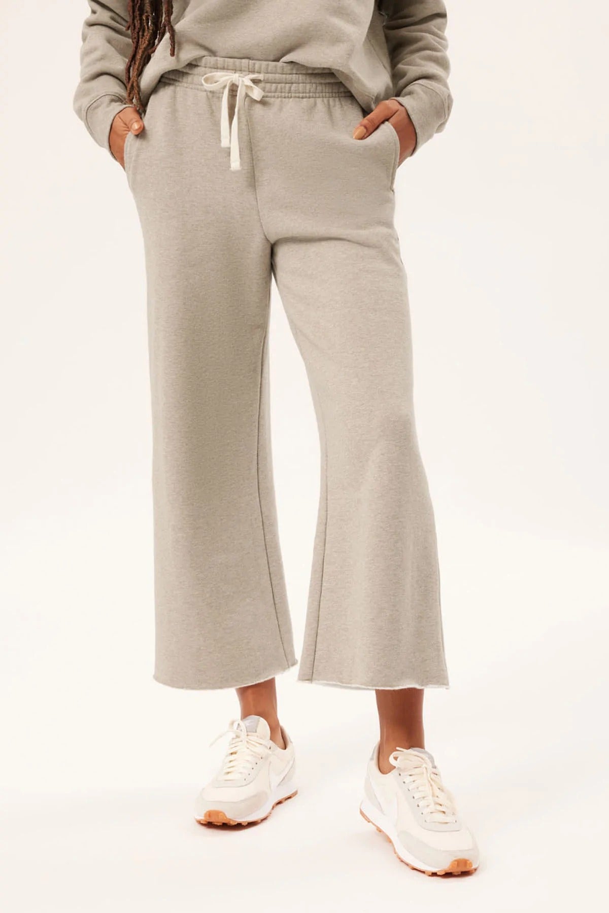 model wearing the sweatpants in grey