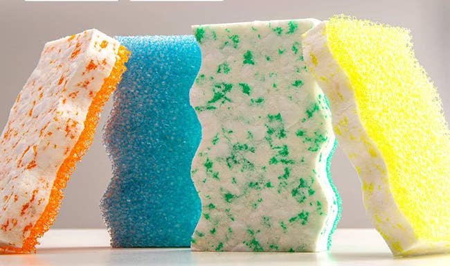 Sponges with a rough side and a smoother colorful speckled side 