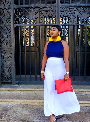 reviewer wearing white skirt