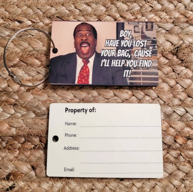 a luggage tag with Stanley from The Office on it that says 