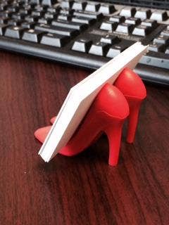 reviewer's red shoe holder with business cards in it