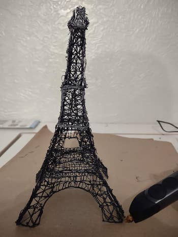 reviewer image of a 3D printed mini Eiffel Tower